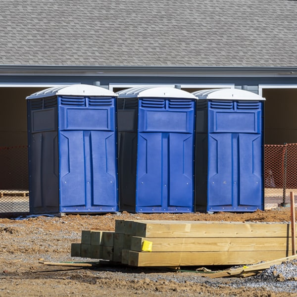 what is the cost difference between standard and deluxe portable restroom rentals in Fairview